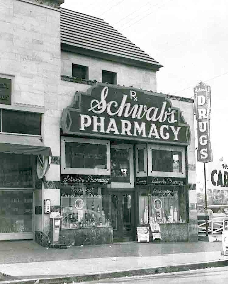 Southeast corner of Sunset Blvd and Crescent Heights Blvd showing Schwab's  Pharmacy and Googie's coffee shop, Los Angeles, circa late 1950s