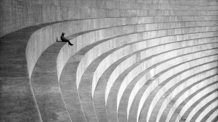 An anonymous gent sits on the huge steps on the front of the Mulholland ...