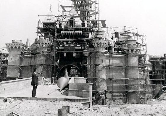 Walt Disney surveys the construction of Sleeping Beauty’s castle under ...